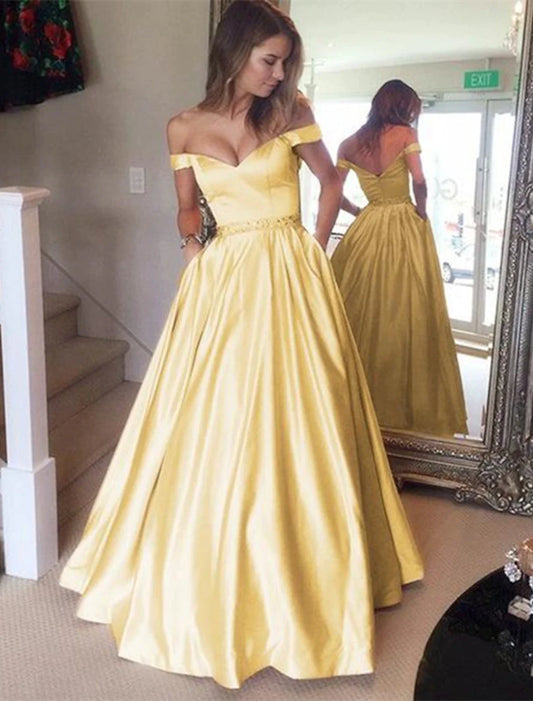 Woman wearing an elegant off-shoulder satin ball gown with short sleeves, pleats, and a floor-length skirt.