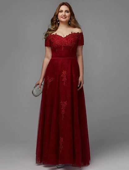 Plus size A-line wedding guest dress with off-shoulder neckline and lace details.