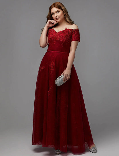 Back view of a plus size A-line dress showing lace-up closure and floor-length skirt.