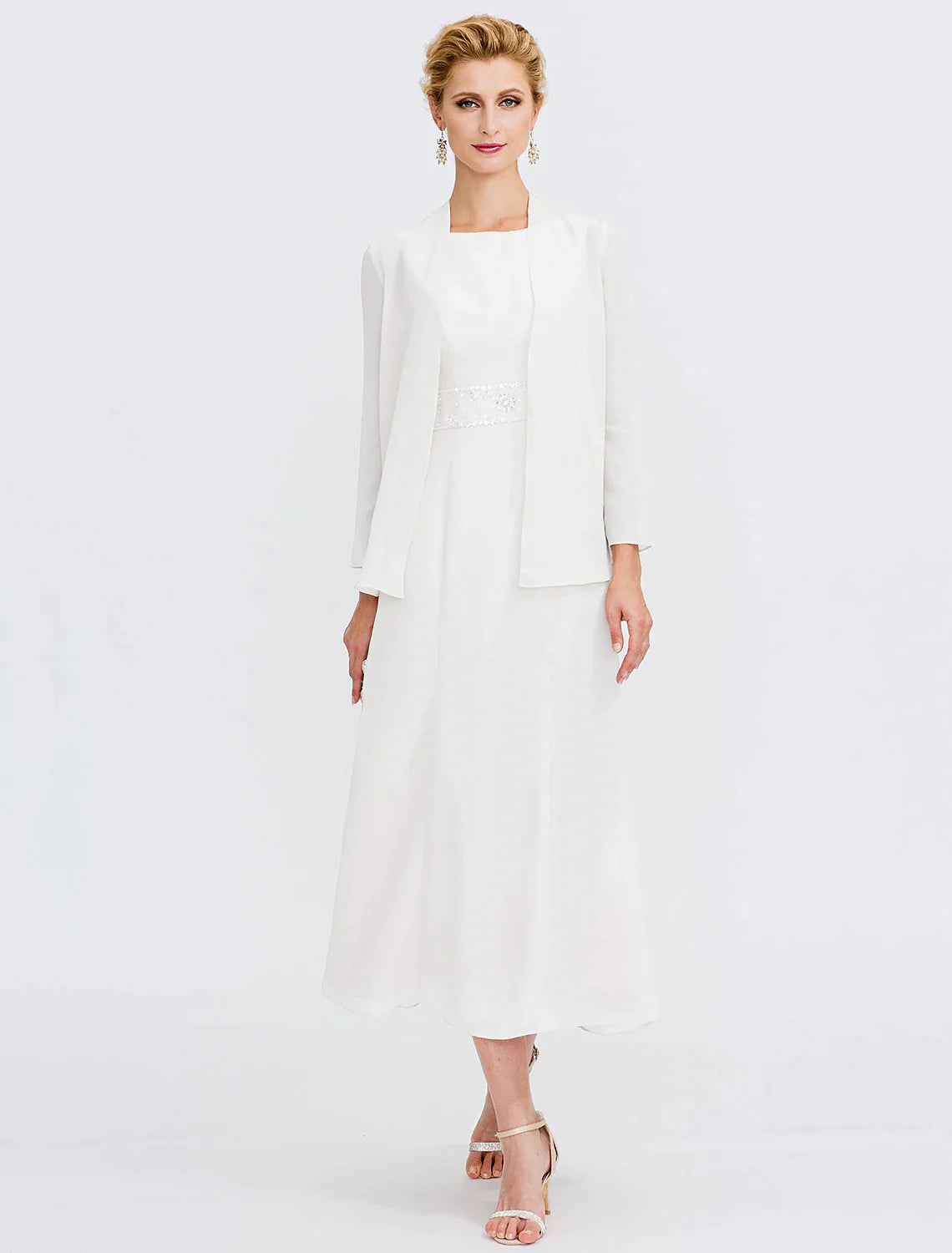 Close-up of the jewel neck and beaded detail on the chiffon dress.