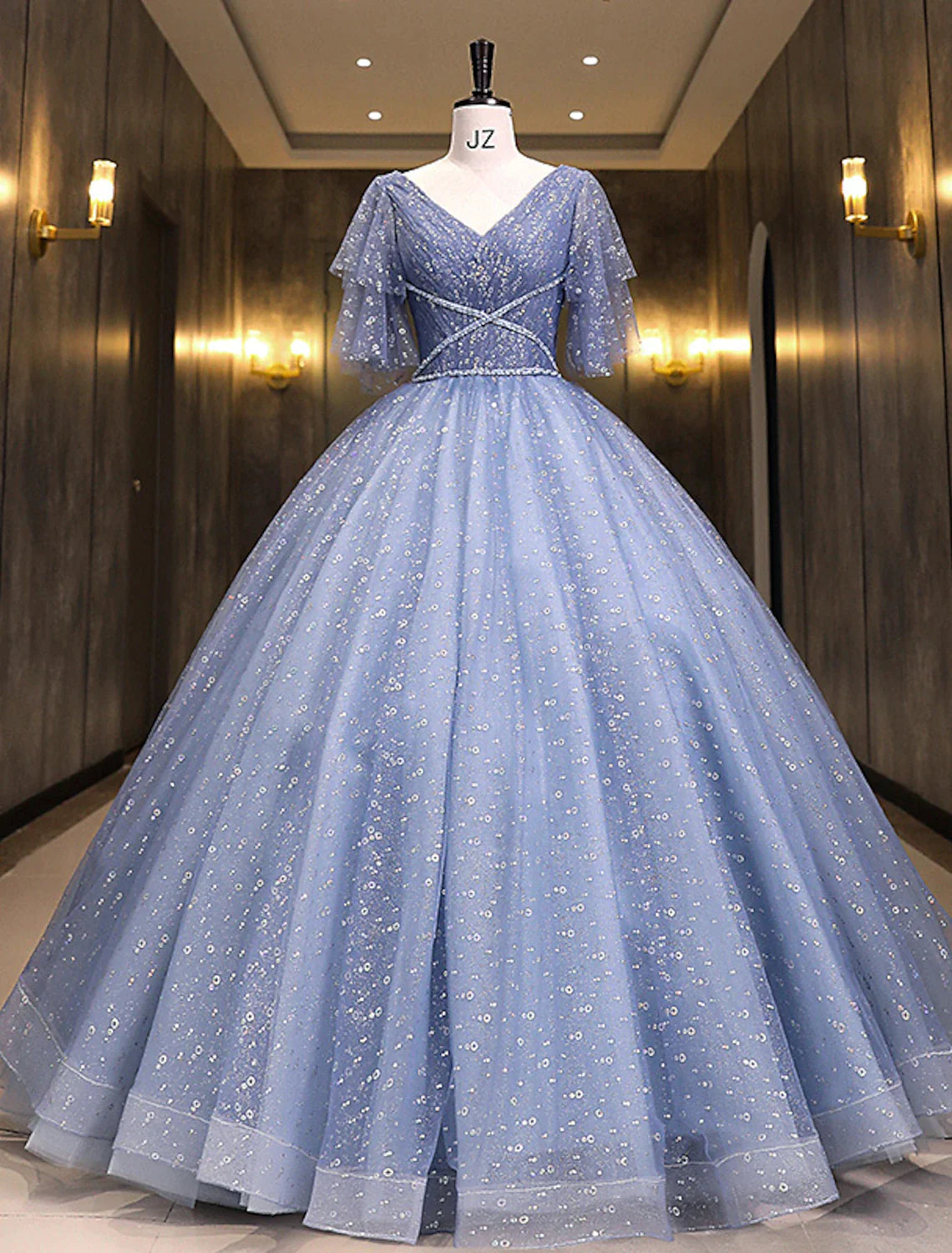 Full view of an elegant sequin ball gown Quinceanera dress with short sleeves and V-neck.