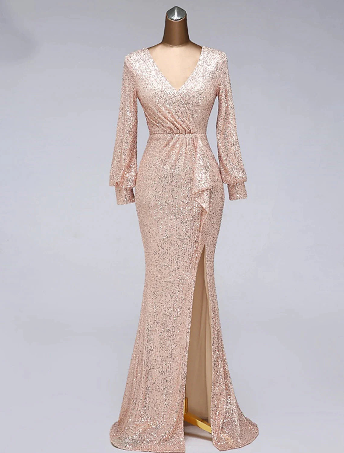 Model wearing an elegant long sleeve V-neck sequin tulle mermaid trumpet gown.