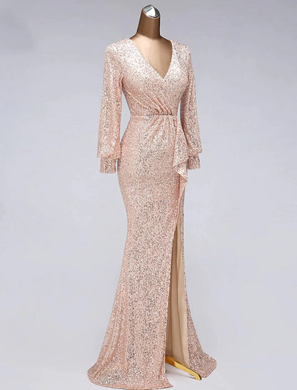 Side view of the V-neck sequin tulle mermaid trumpet gown with a slit.