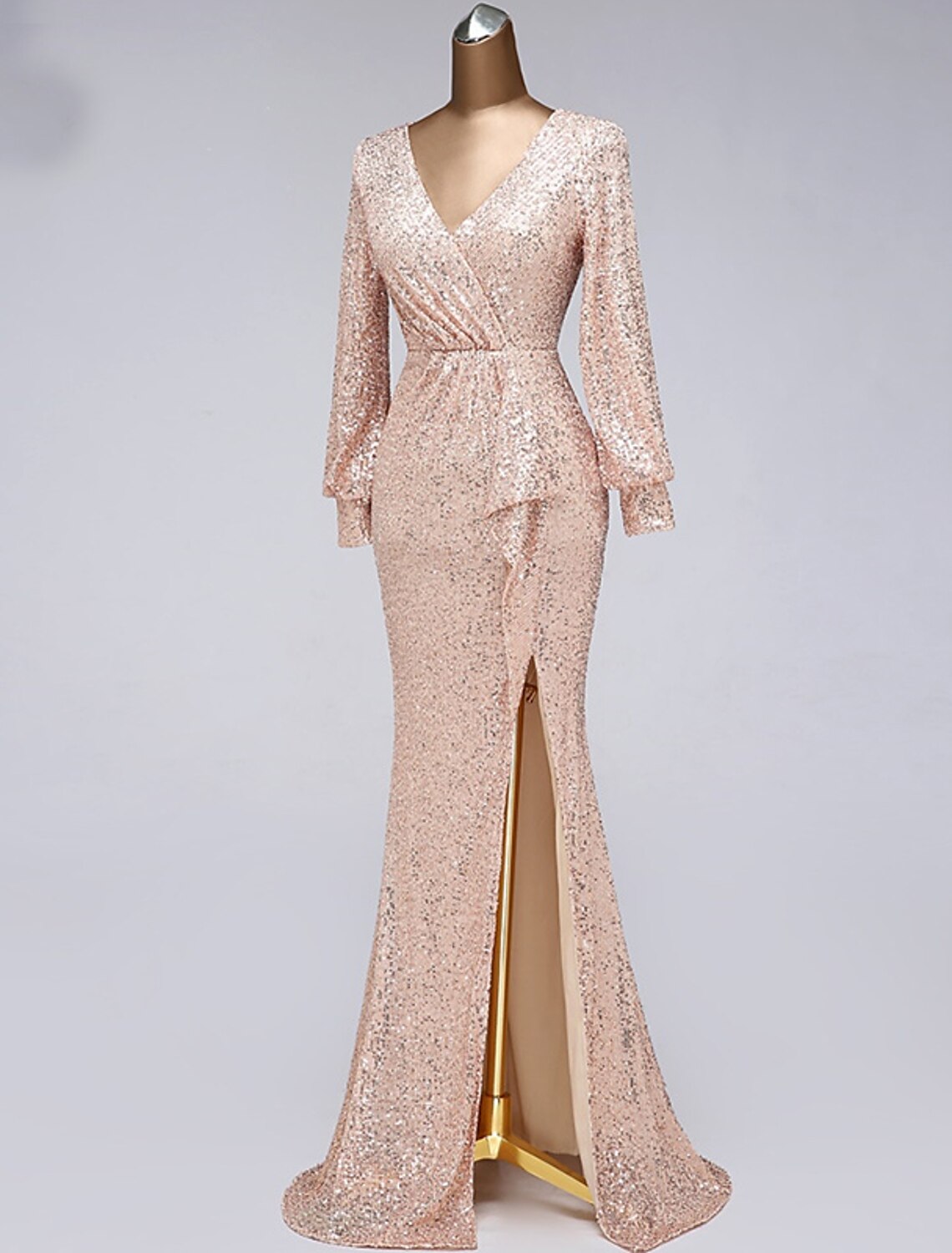 Model showcasing the full silhouette of the mermaid trumpet evening gown.