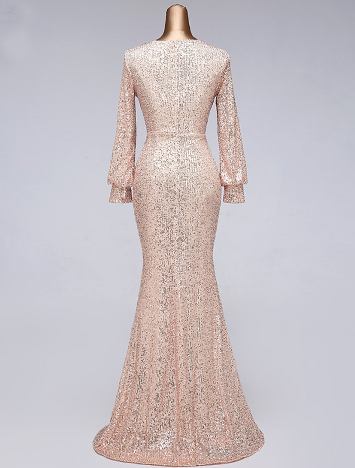 Detail of the V-neckline and long sleeves on the sequin mermaid trumpet dress.