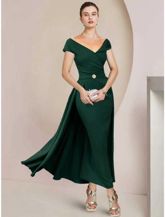 Elegant V-neck sheath column mother of the bride dress with short sleeves, pleats, and a crystal brooch.