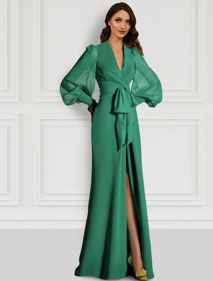 Elegant sage sheath evening gown with V-neck, long sleeves, and a front slit.