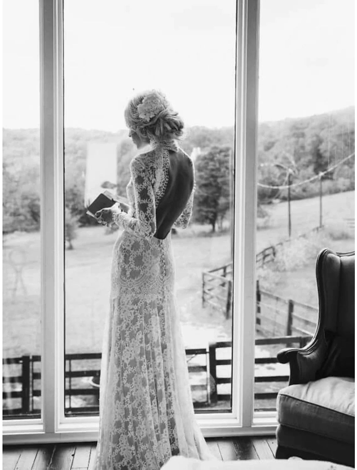 Back view of an elegant high neck bridal gown with appliques and court train.