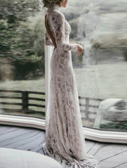 Detailed view of lace appliques on a bridal gown.