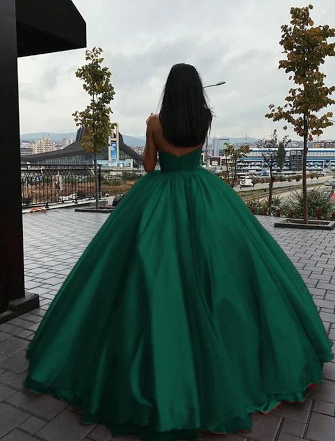 Back view of the elegant strapless ball gown, highlighting the beautiful back design.