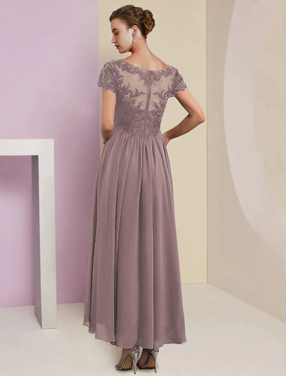Formal tea-length dress featuring lace details and pleats.