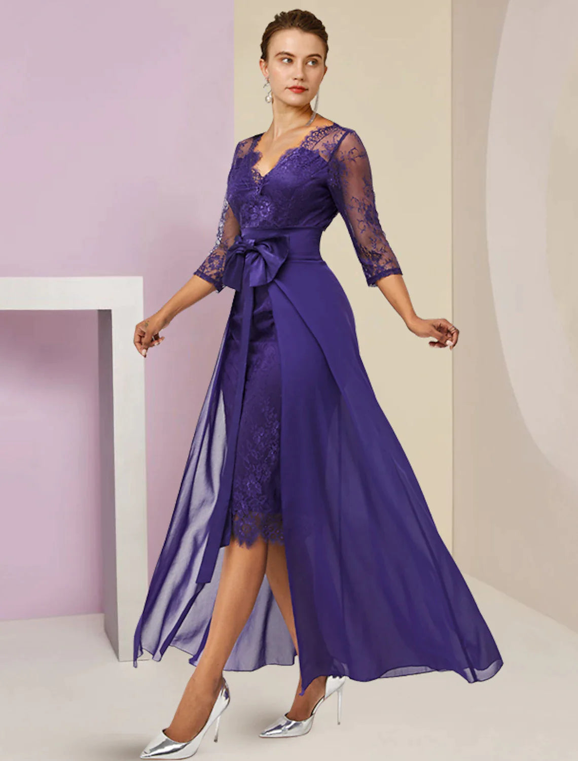 Model wearing an elegant two-piece sheath Mother of the Bride dress with V-neck and 3/4 lace sleeves.