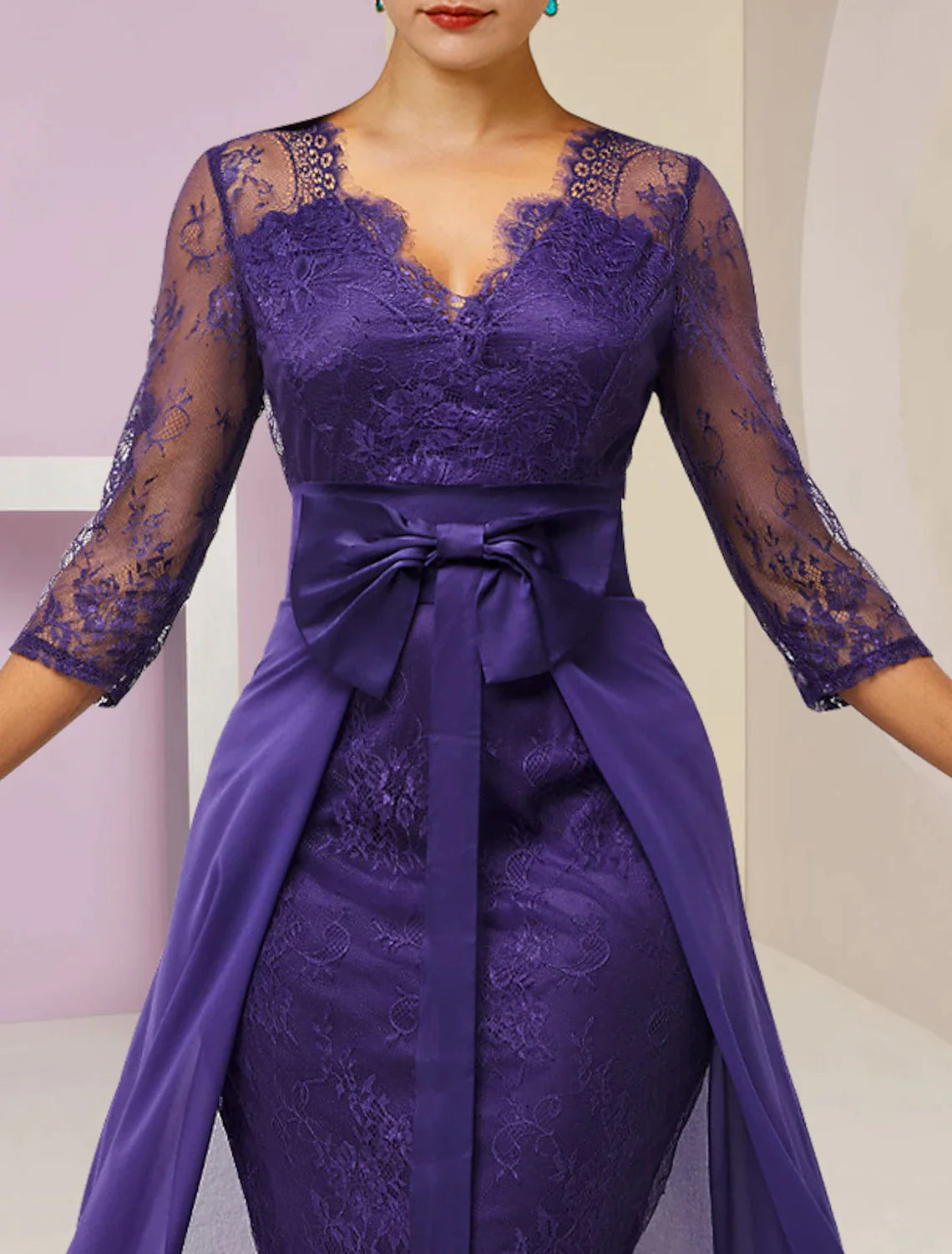 Back view of the two-piece knee-length Mother of the Bride dress, showing the elegant silhouette.