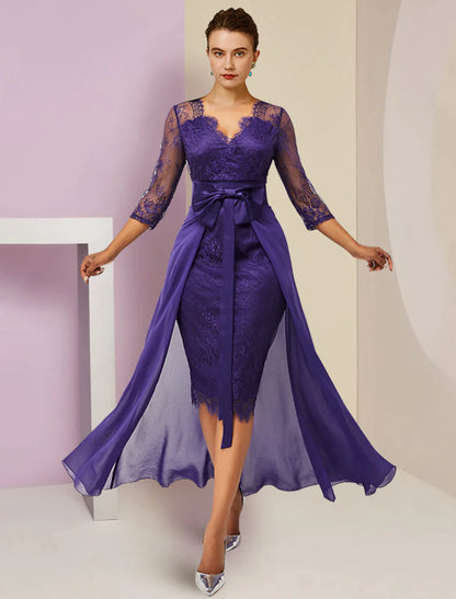 Detail of the 3/4 length lace sleeves and flowing chiffon skirt of the formal dress.