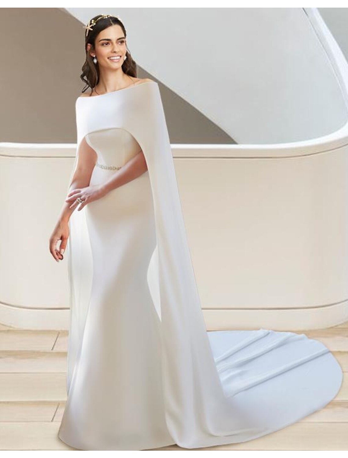 Elegant two-piece sweetheart strapless wedding dress with a flowing court train.