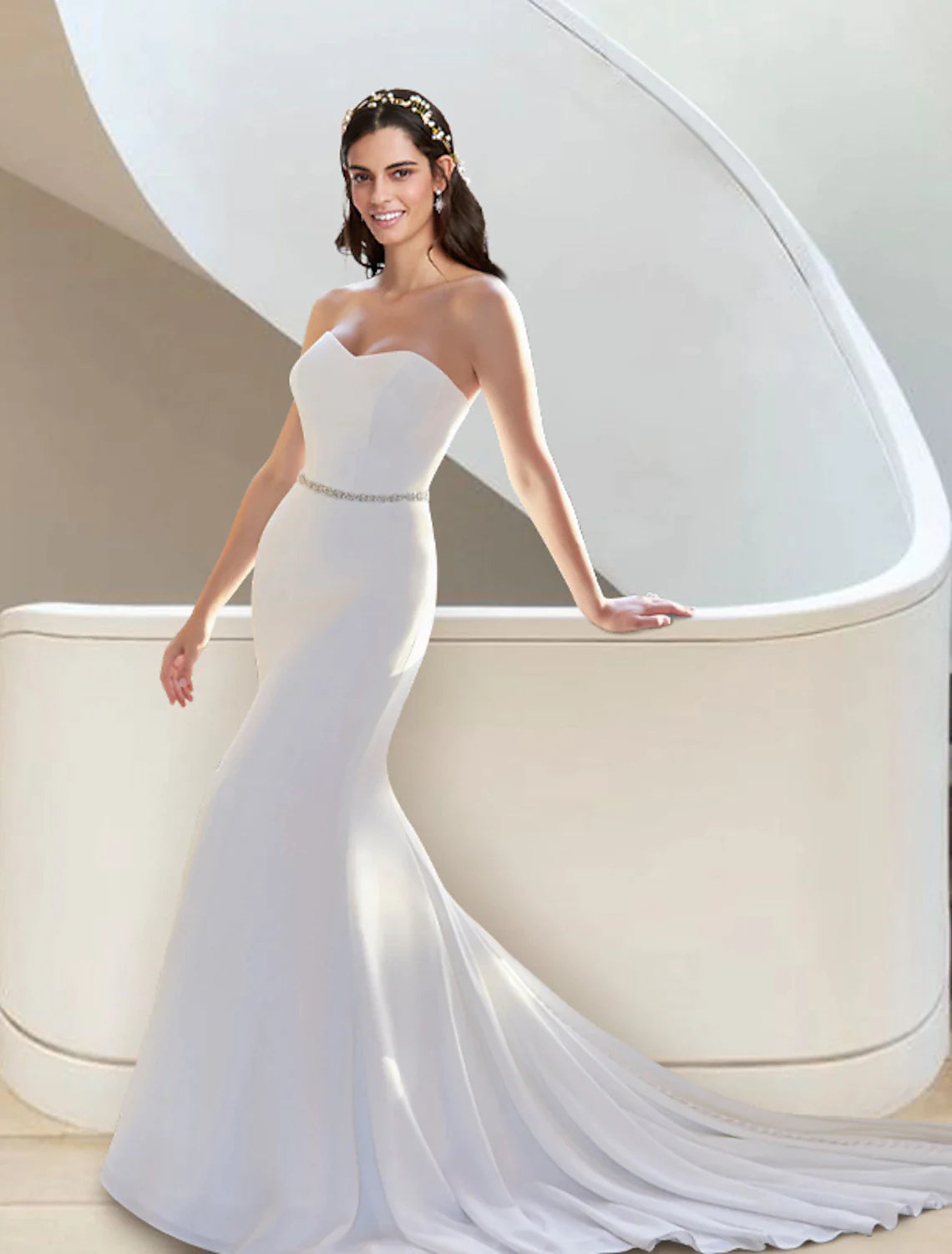 Close-up of the sweetheart neckline and fitted bodice of the two-piece bridal gown.
