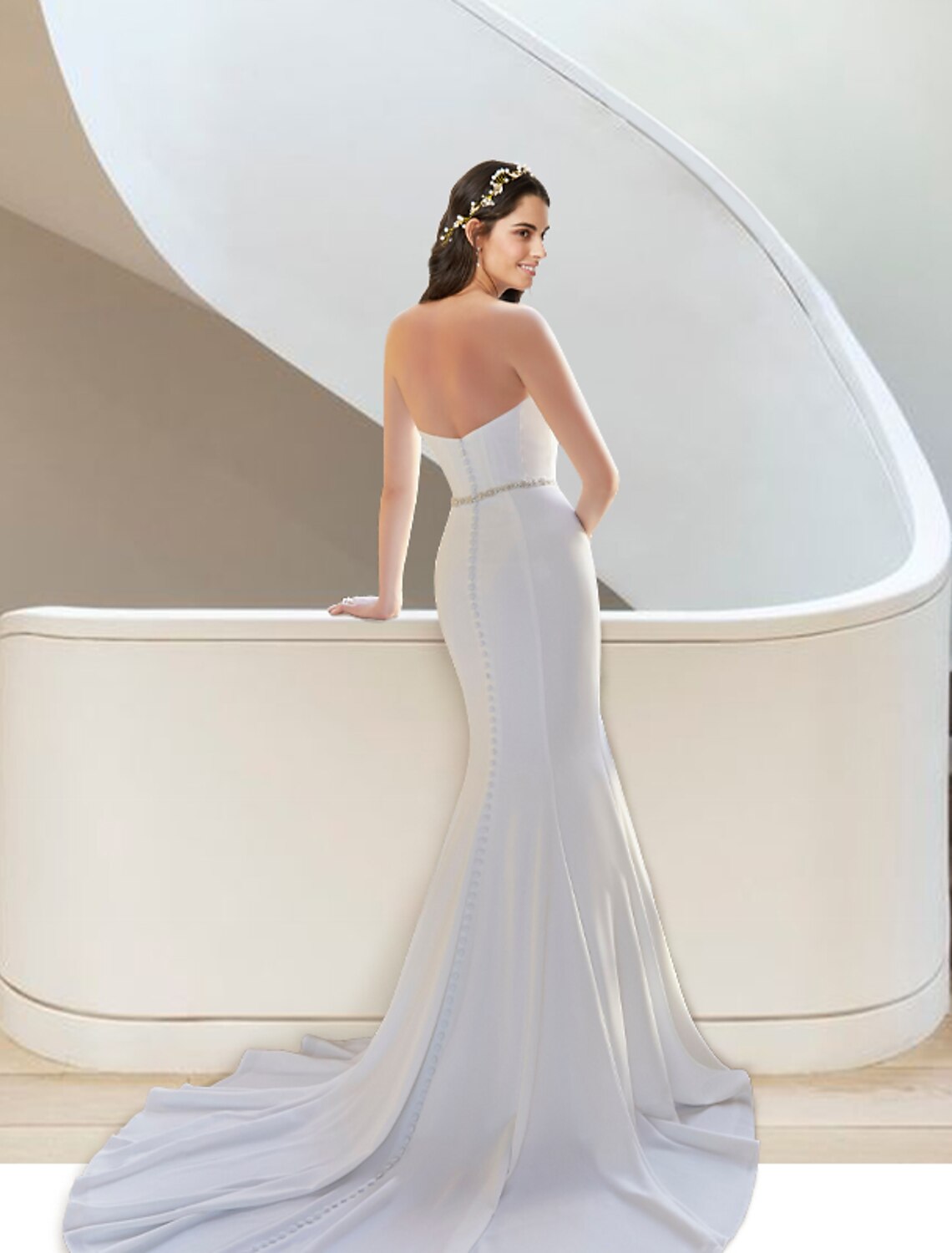 Back view of the two-piece wedding dress, showcasing the court train and stretch fabric.