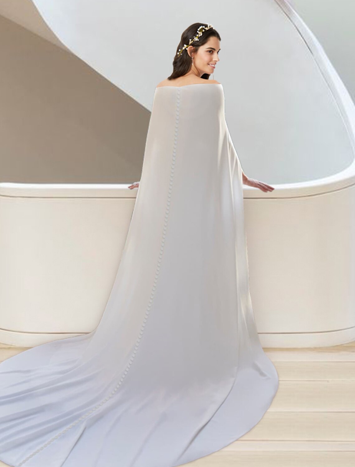 Detail of the stretch fabric and sash on the two-piece sweetheart wedding dress.