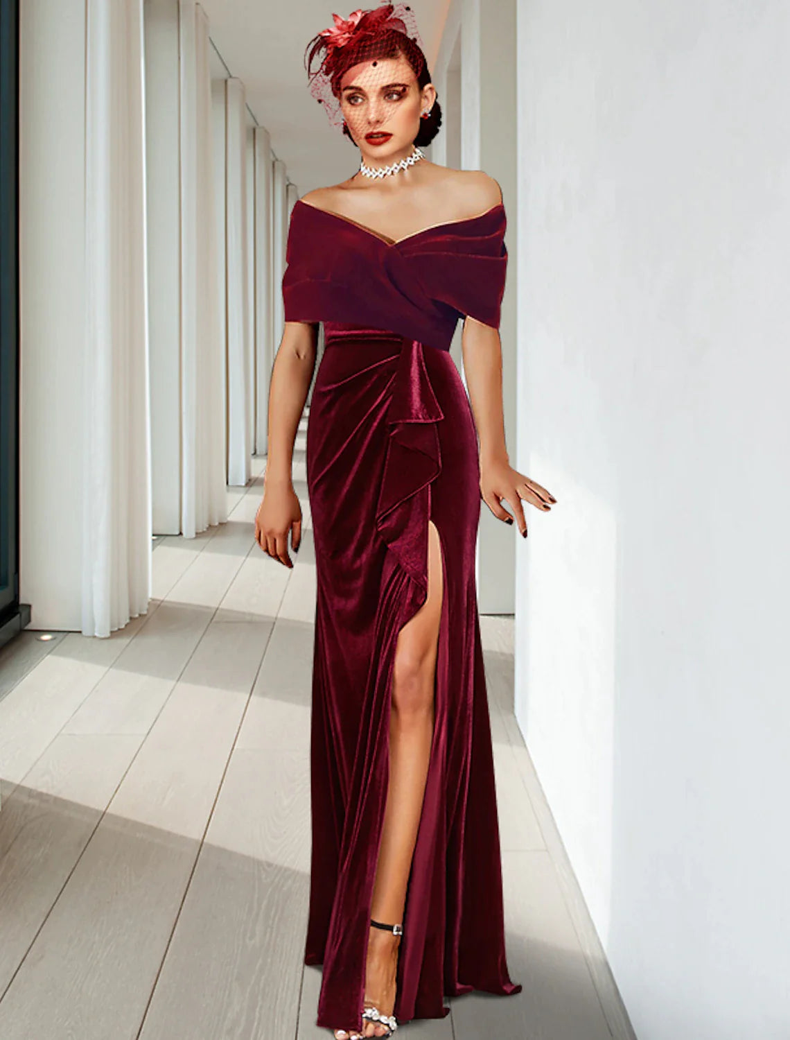 Elegant dark velvet sheath column gown with V-neck, pleats, and ruffles.
