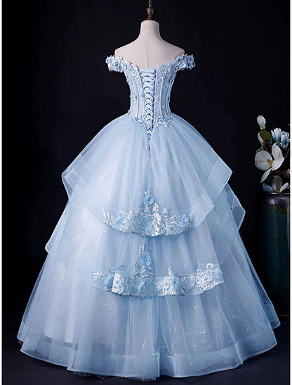 White off-shoulder ball gown with full skirt, side view.