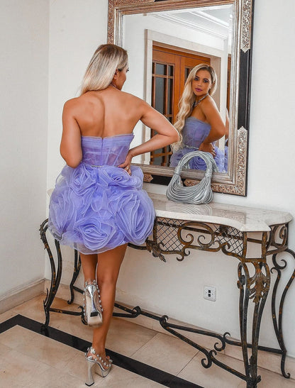 Full-length view of the floral organza ball gown, emphasizing its elegant drape and design.