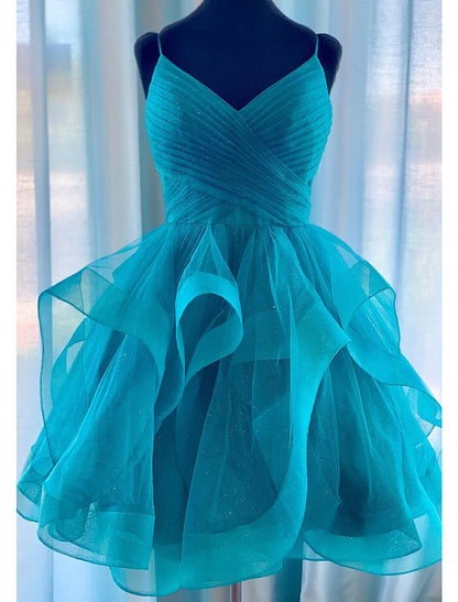 Back view of a glitter tulle A-line ball gown with spaghetti straps.