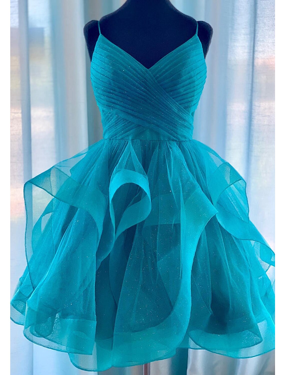 Full view of the sleeveless spaghetti strap glittering mini ball gown dress.