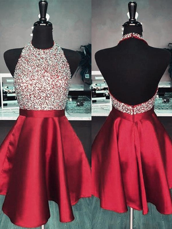 Royal blue A-line halter homecoming dress with intricate beading.
