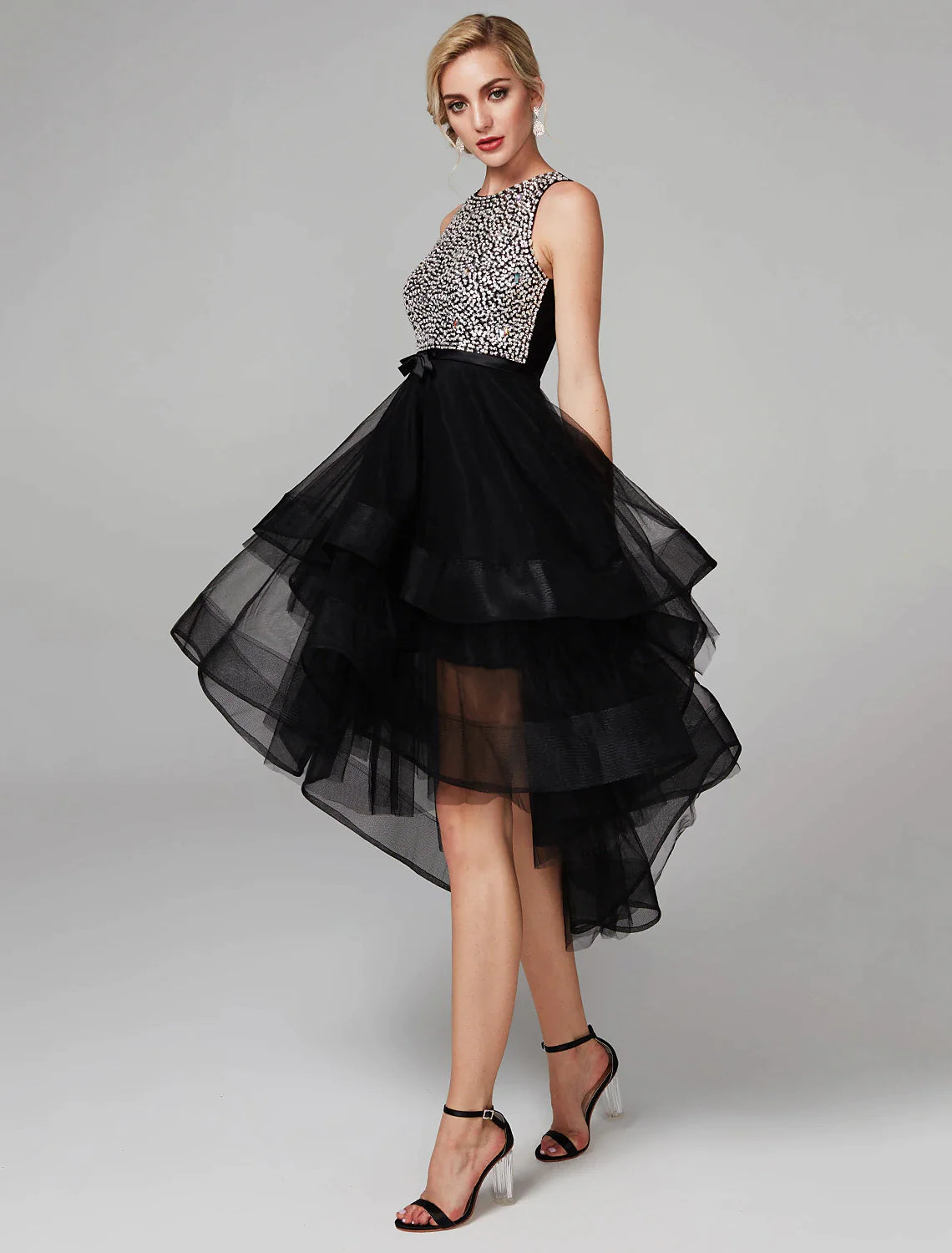 Knee-length satin ball gown homecoming dress with beading and cascading ruffles.