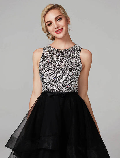 Close-up of the beaded detail and cascading ruffles on the satin dress.