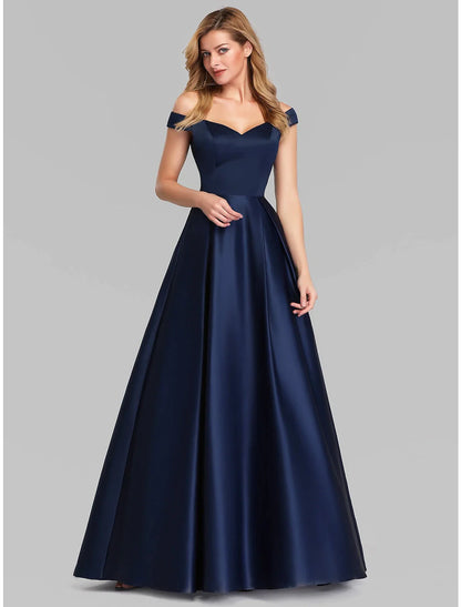 Close-up of the plunging neckline and ruched bodice on a dark charmeuse A-Line evening gown.