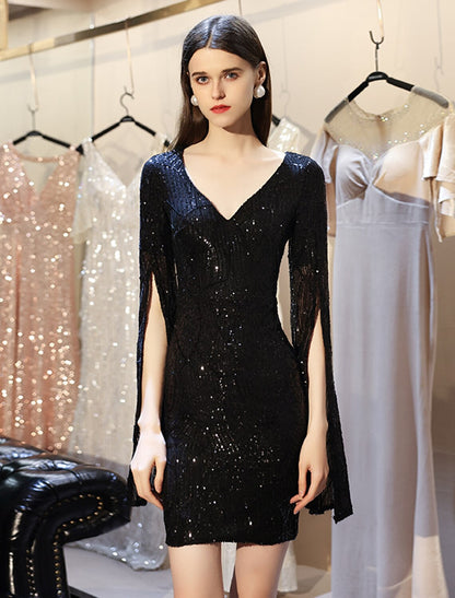 Model wearing a sparkling sequin sheath dress with a V-neck and long sleeves.
