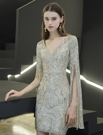Close-up of the shimmering sequin fabric and V-neck design on the dress.