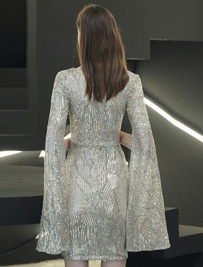 Elegant long sleeves of the sequin party dress, worn by a model.