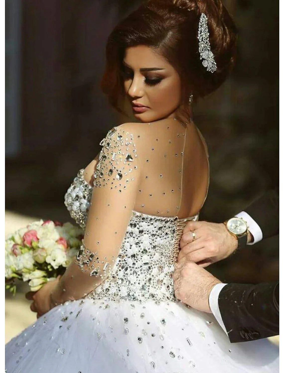 Side profile of the satin ball gown bridal dress with intricate crystal details.