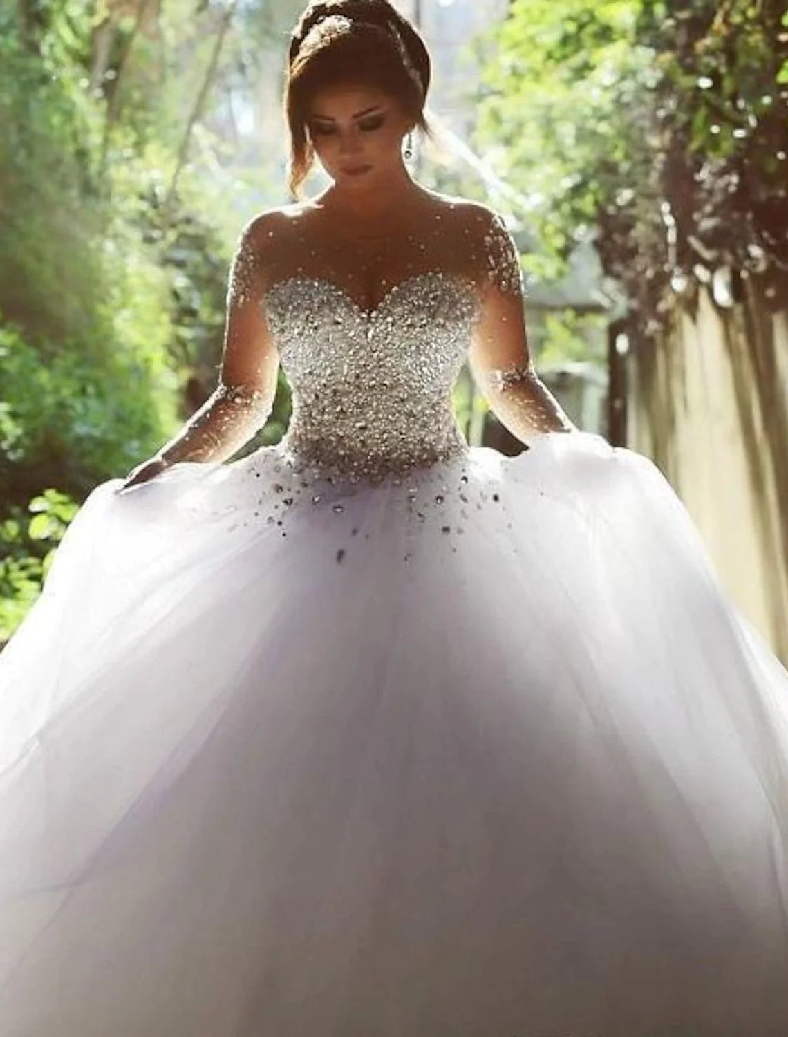 Close-up of the sweetheart neckline and sparkling crystal embellishments on the wedding gown.