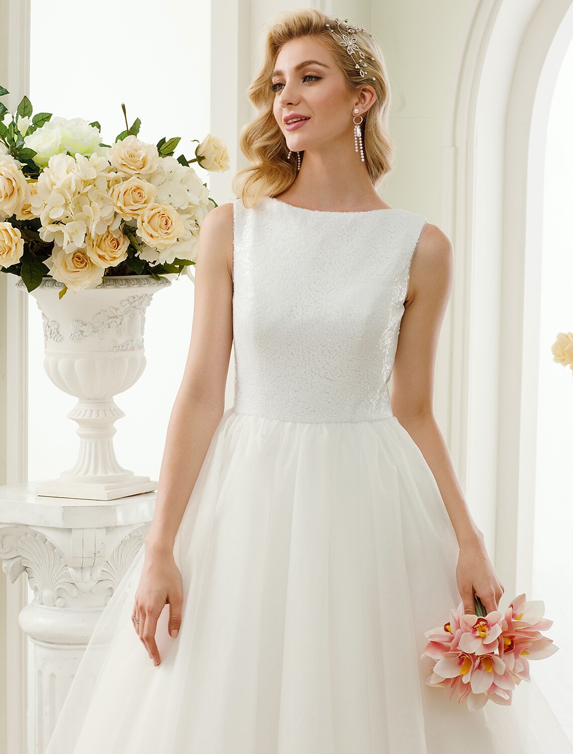 Back view of the A-line tulle wedding dress, showcasing the tea length.