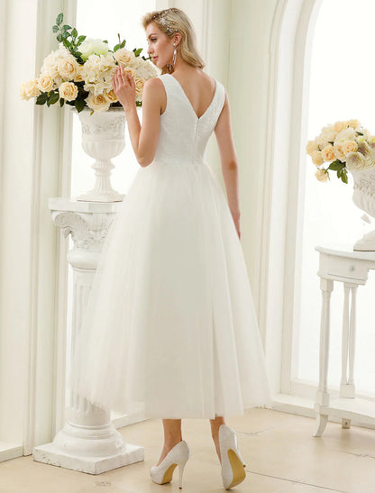 Side profile of the bride in the sparkling lace and sequin reception dress.