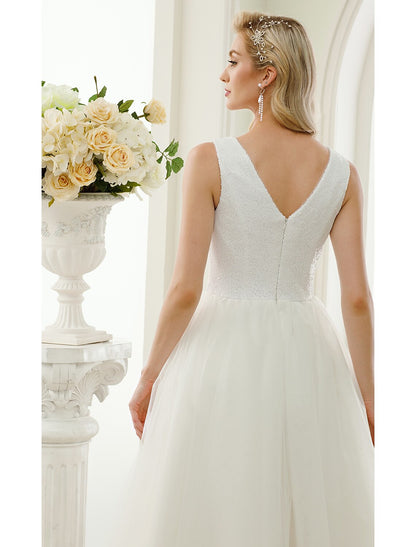 Close-up of the sparkling fabric and design details of the wedding dress.