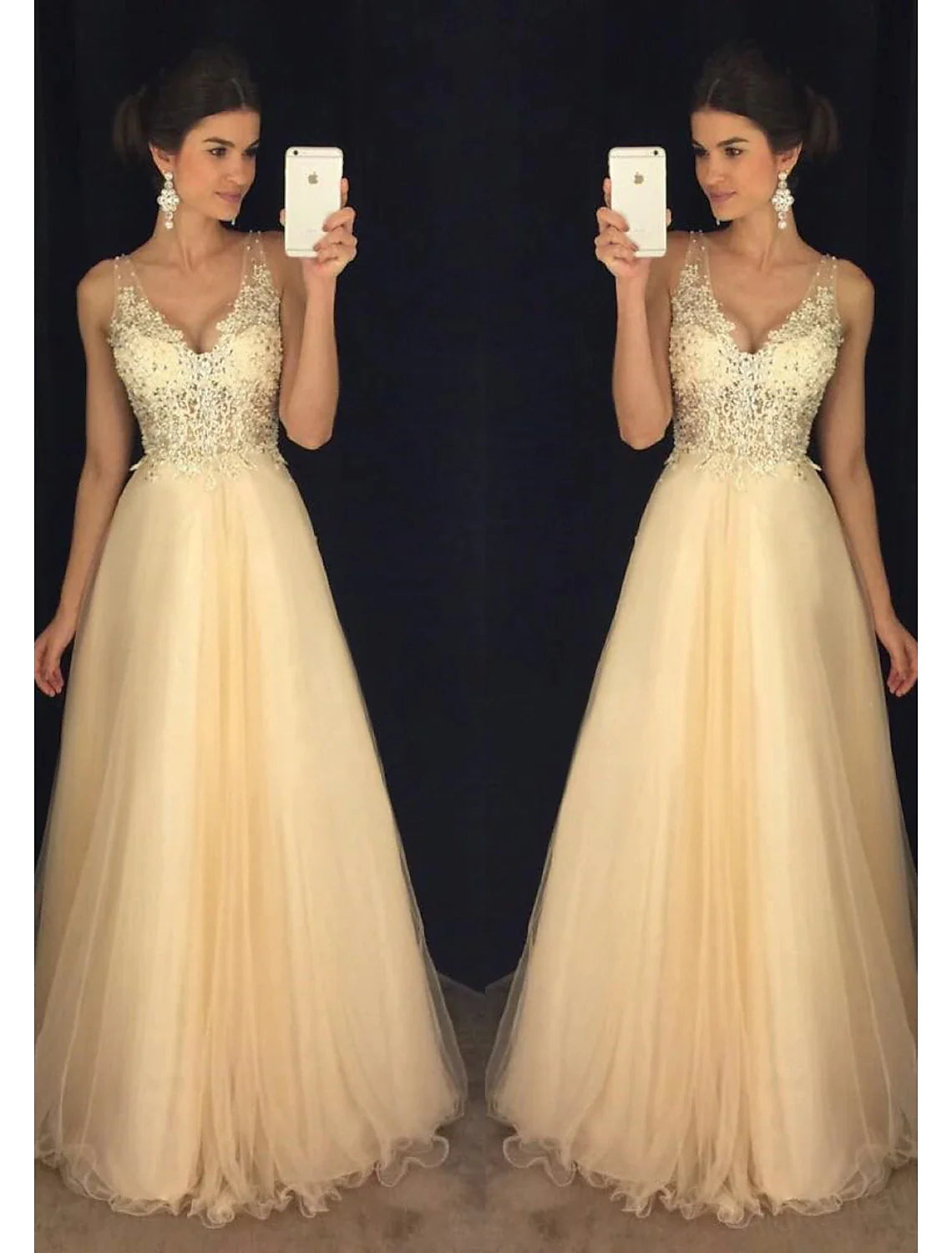 Model wearing a sparkling A-Line V-neck tulle prom dress with beading appliques, front view.