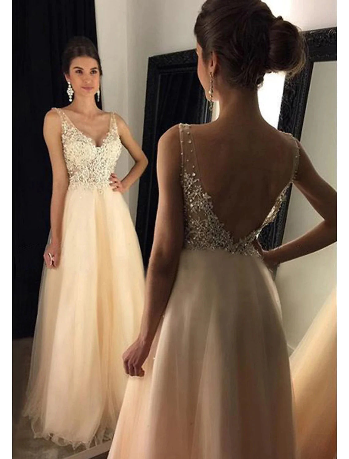 Model showcasing the V-back and floor-length design of the sparkling A-Line prom dress.