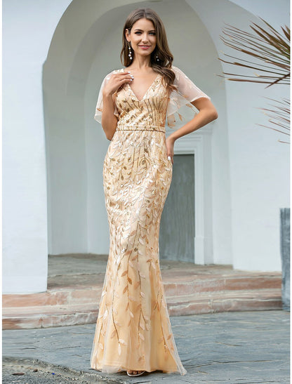 Woman wearing a sparkling V-neck short sleeve mermaid trumpet evening gown.
