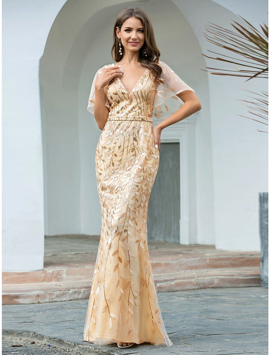 Woman wearing a sparkling V-neck short sleeve mermaid trumpet evening gown.