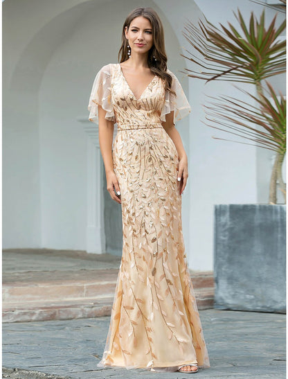 Detailed view of the shimmering sequin and delicate tulle fabric on the gown.