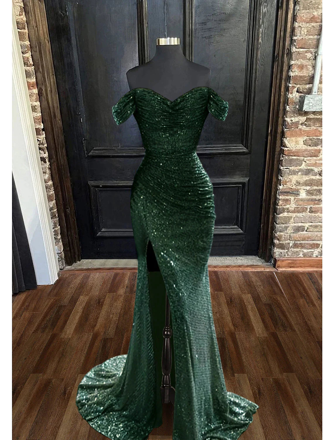 Side profile of a model showcasing the ruched details of the mermaid gown.