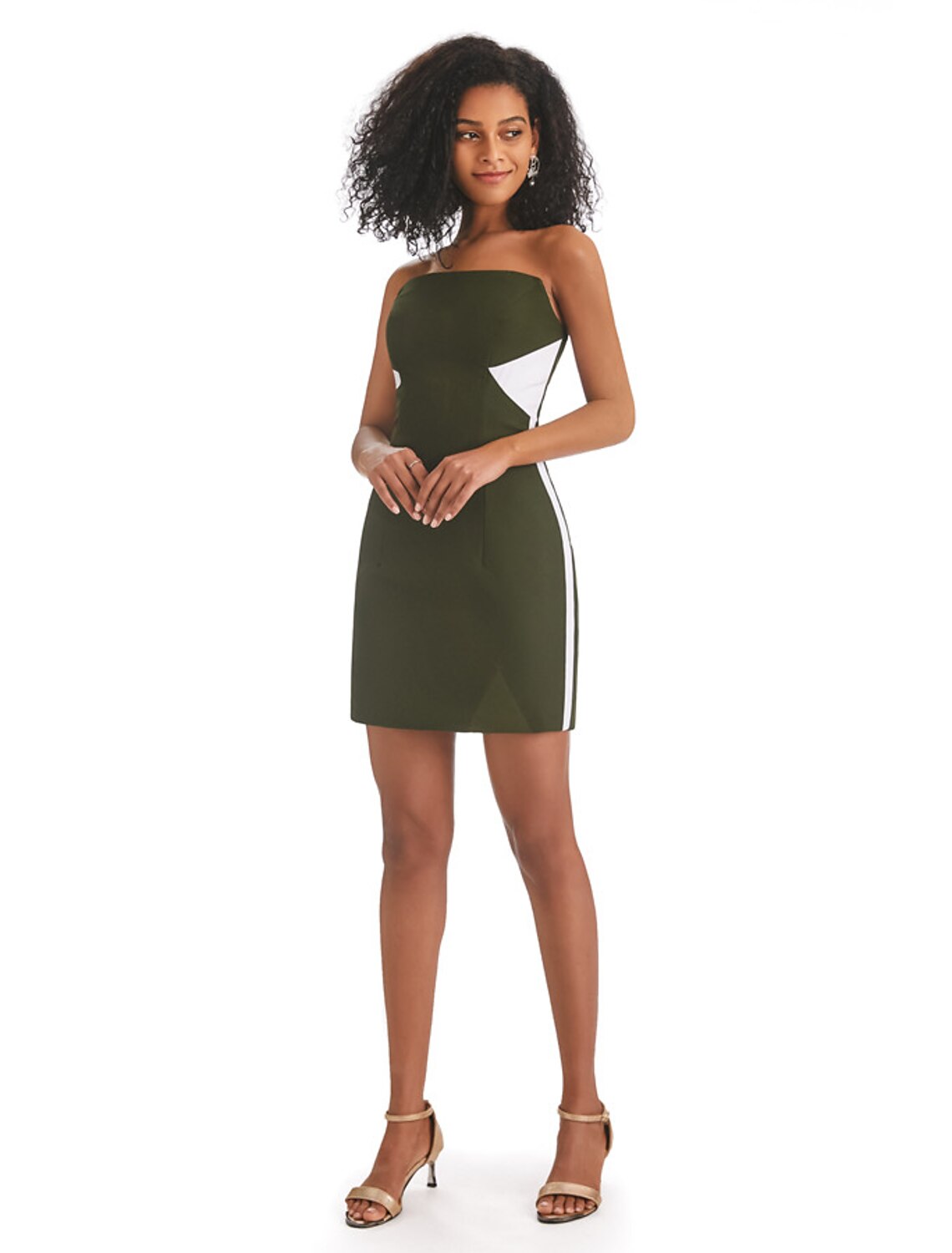 Woman in a stylish strapless color block mini dress with fringe, front view.