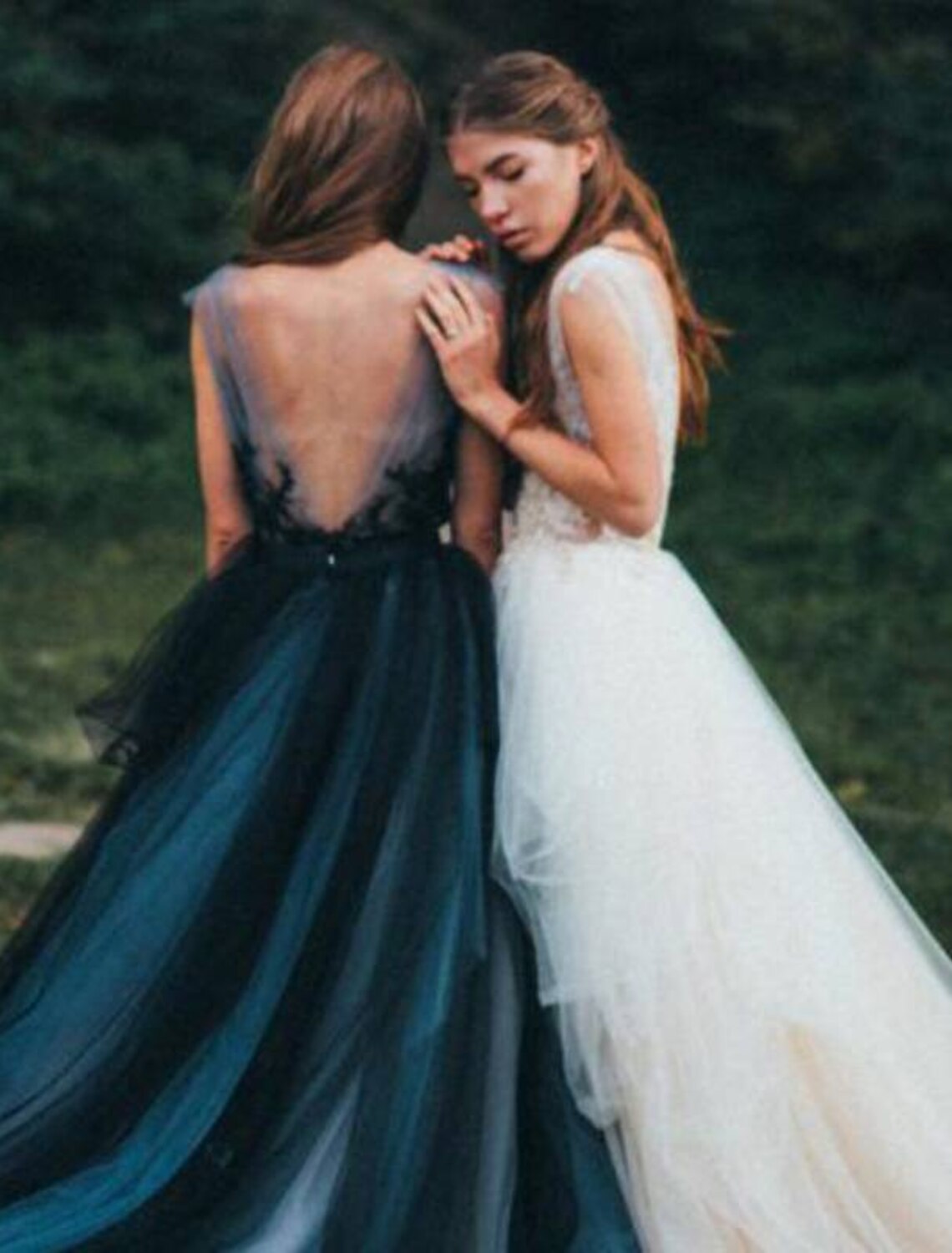 Back view of the color block Quinceanera ball gown, showing the V-back and sweep train.