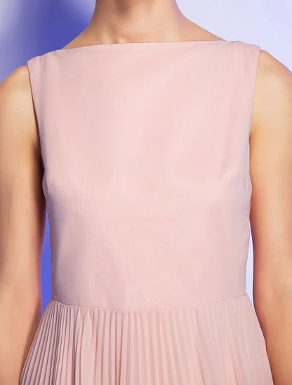 Model wearing a vintage A-line dress, side view.